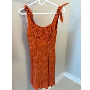 Orange polka dot sleeveless dress with ties